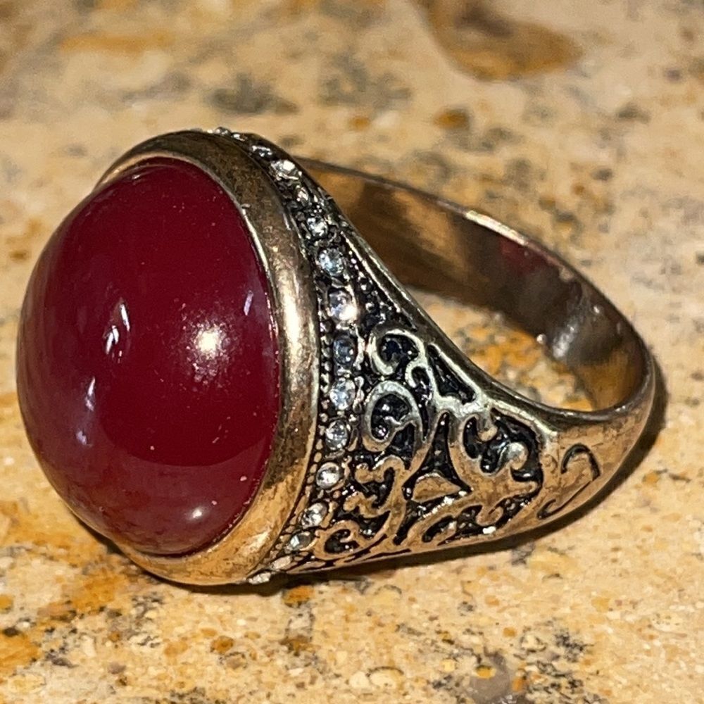 Costume jewelry brass tone ring size 11. Base metal not sterling silver.